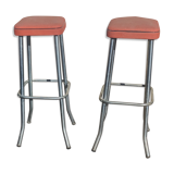 Pair of aluminum bar stools with orange and black seats