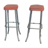 Aluminum bar stools and orange and black seats