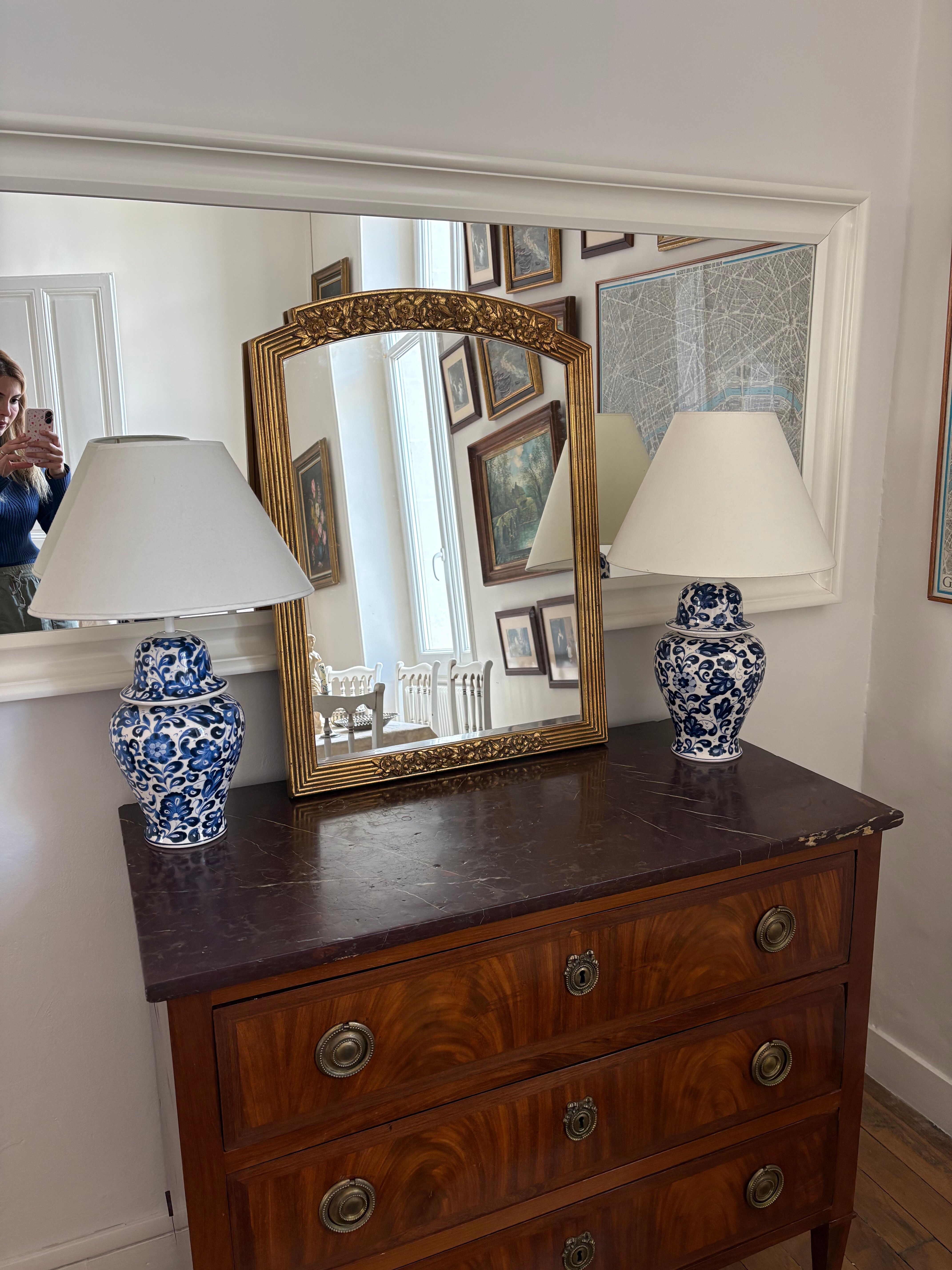 Large vintage gold mirror in Louis XVI style – fluted frame and floral decoration.