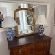 Large vintage gold mirror in Louis XVI style – fluted frame and floral decoration.