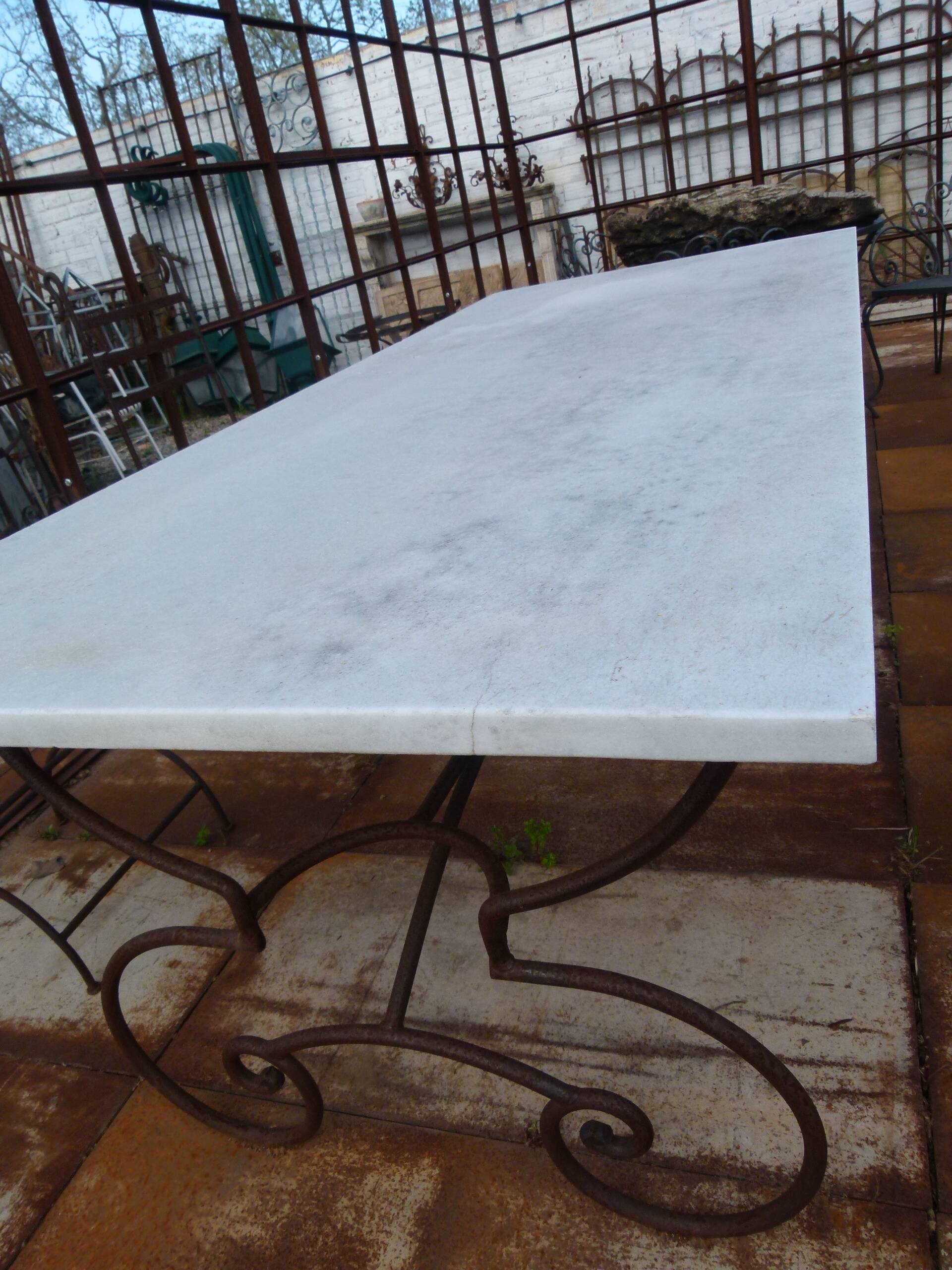 Marble table with wrought iron legs