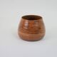 Petit pot en céramique tourné orange et marron