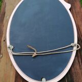 Oval mirror in pink cast iron layette