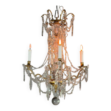 Bronze chandelier with cut crystal pendants, circa 1800.