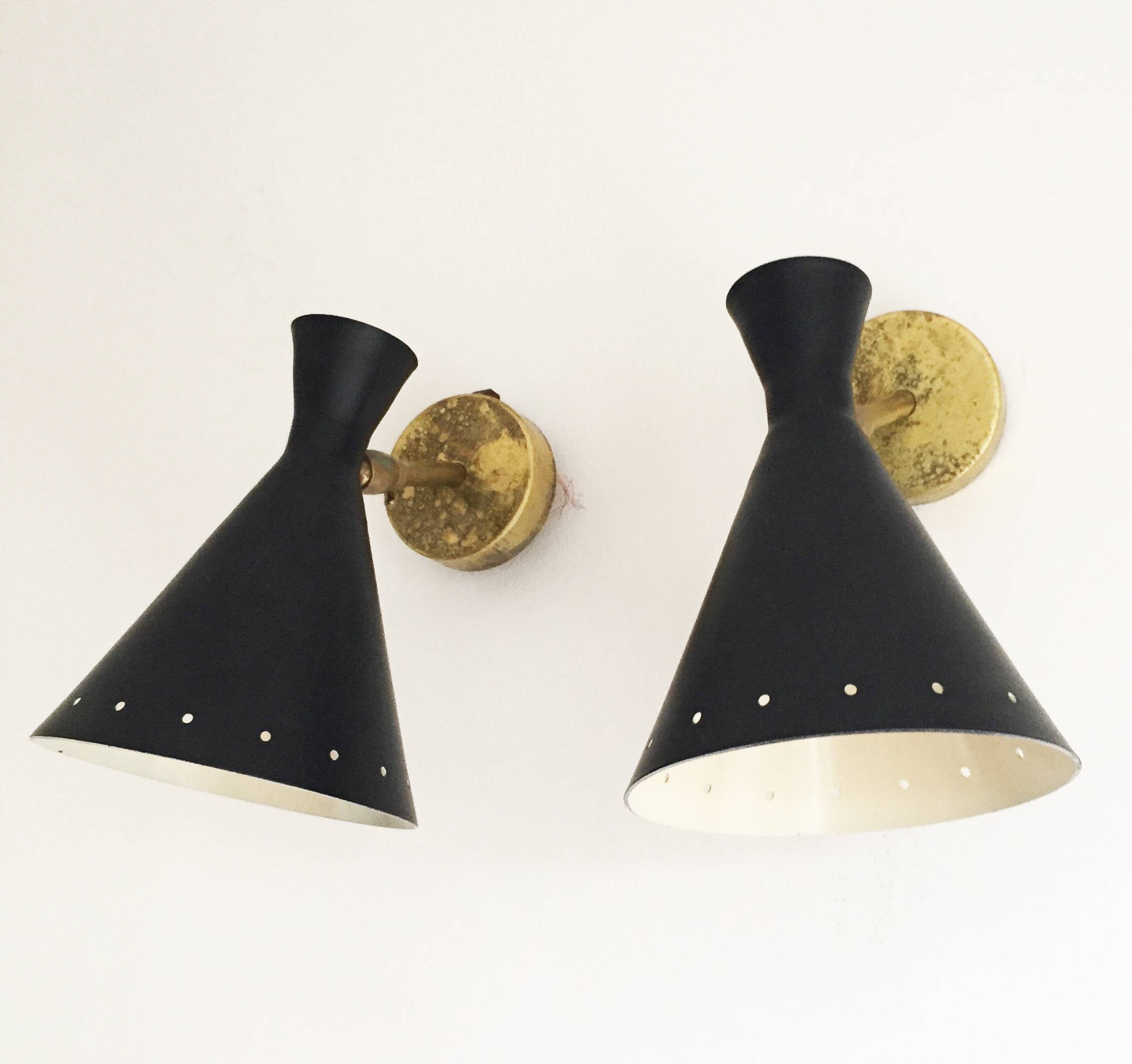 Set of three Italian wall lights in brass and lacquered iron, 1950s design.