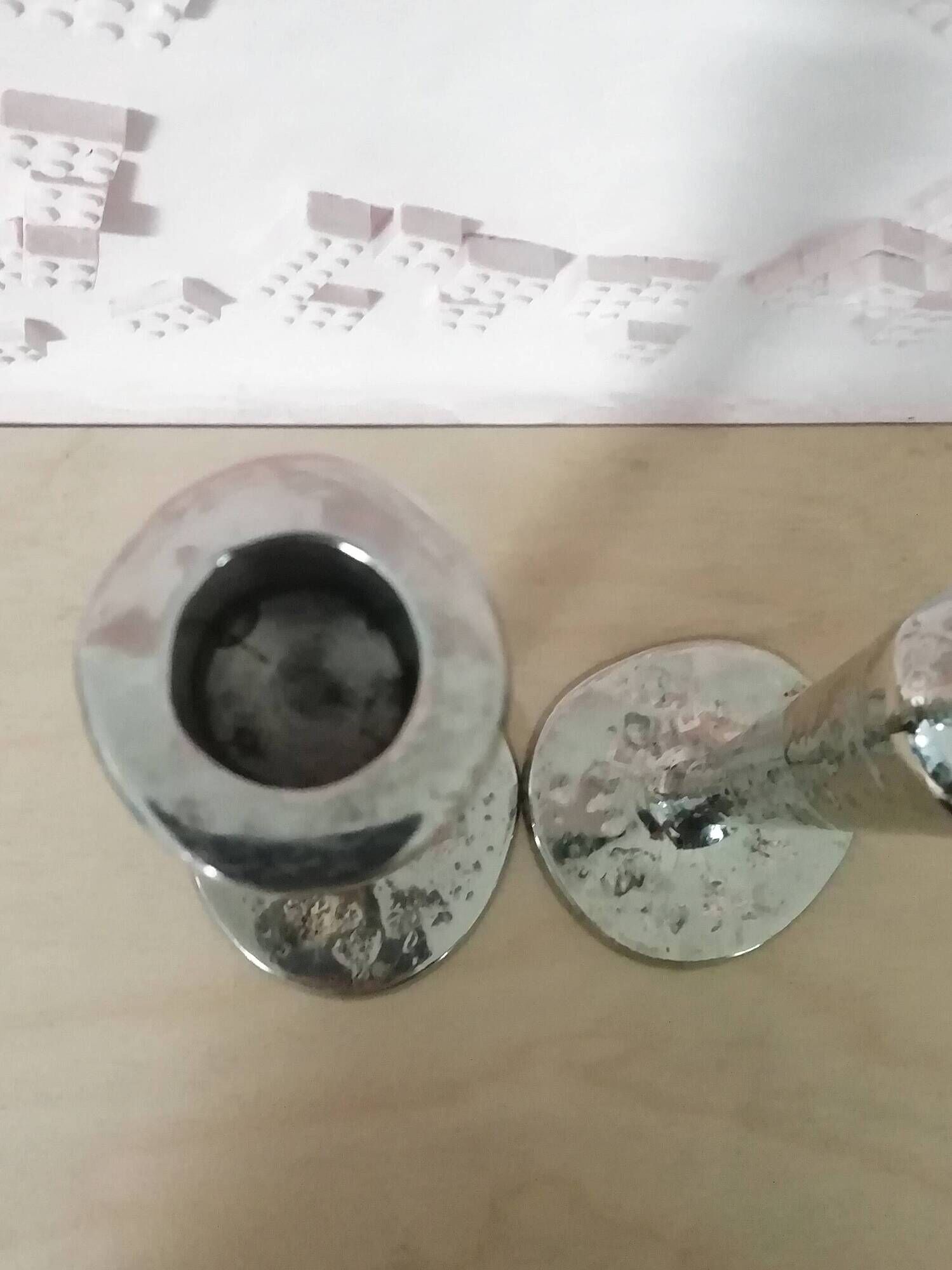 Pair of hammered metal candlesticks