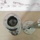 Pair of hammered metal candlesticks
