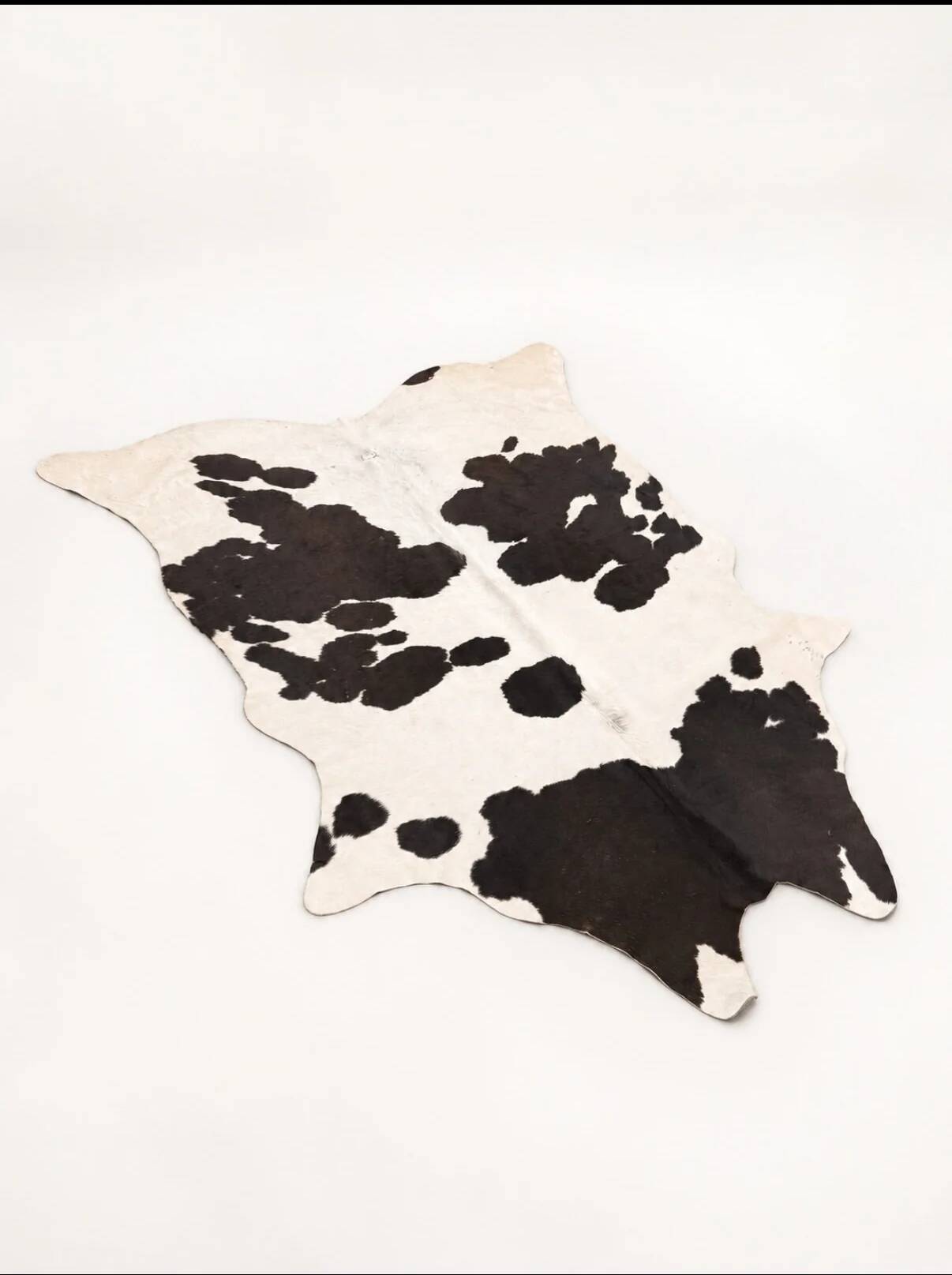 Tapis en peau de vache véritable noir et blanc