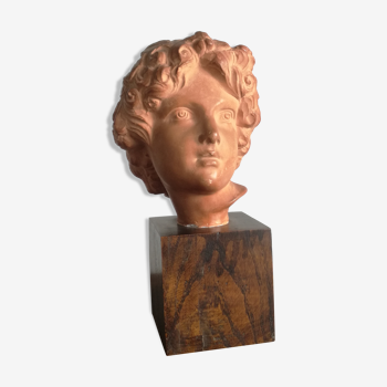 Ancient cherub bust on pedestal