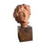 Ancient cherub bust on pedestal