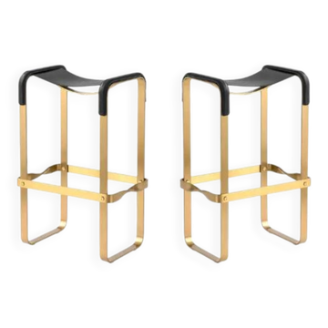 Pair of backless stools Wanderlust in black metal and brass.