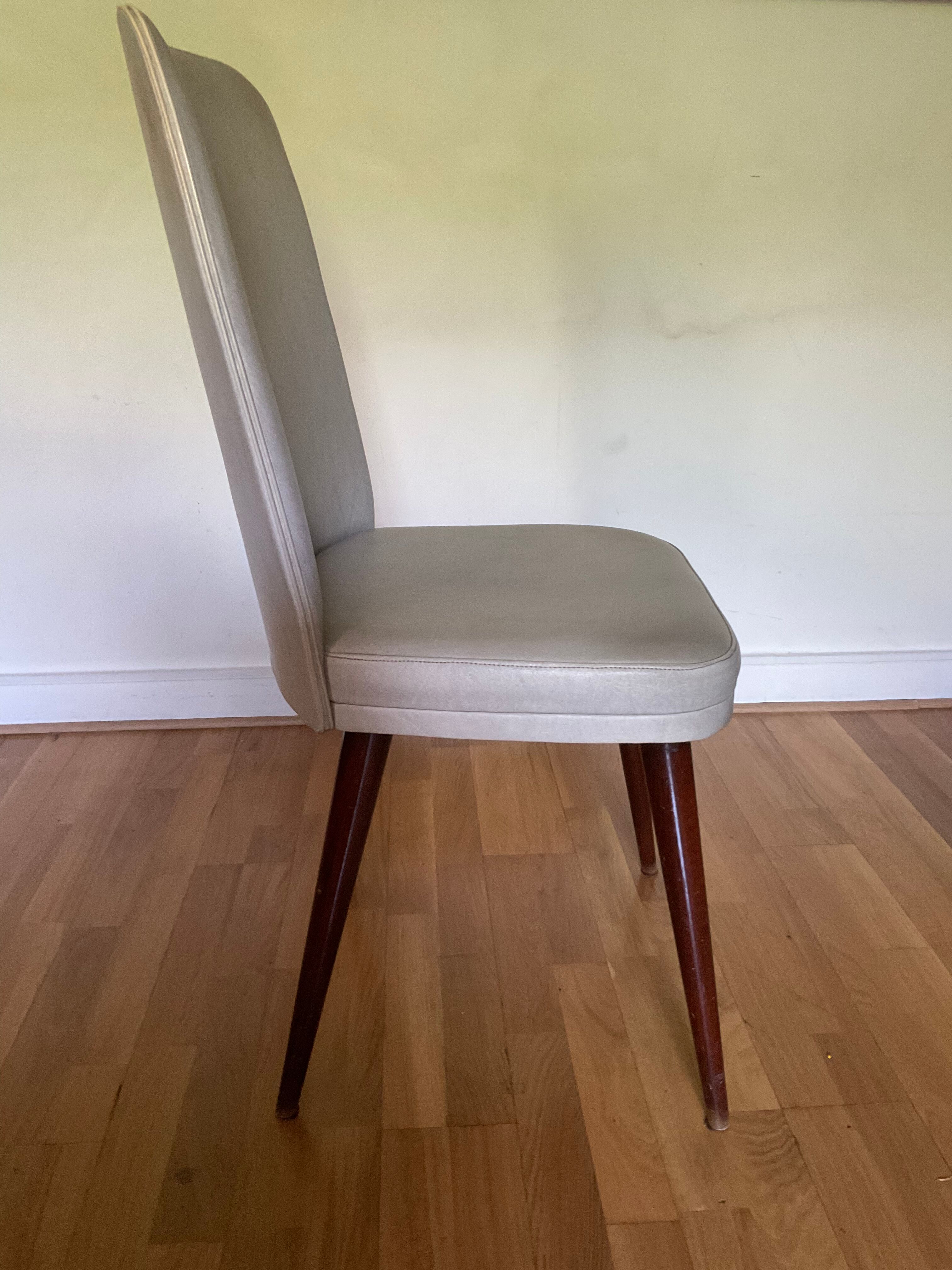 Pair of vintage mahogany and skai chairs