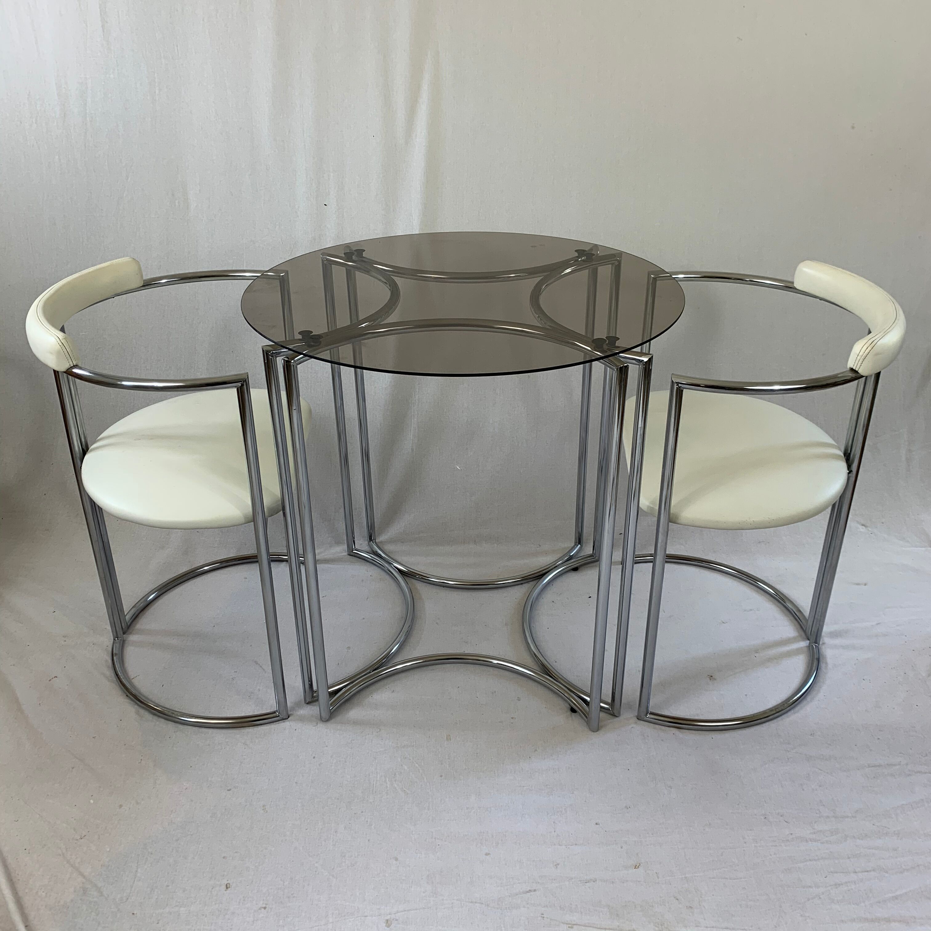 Chrome table and two modernist chairs