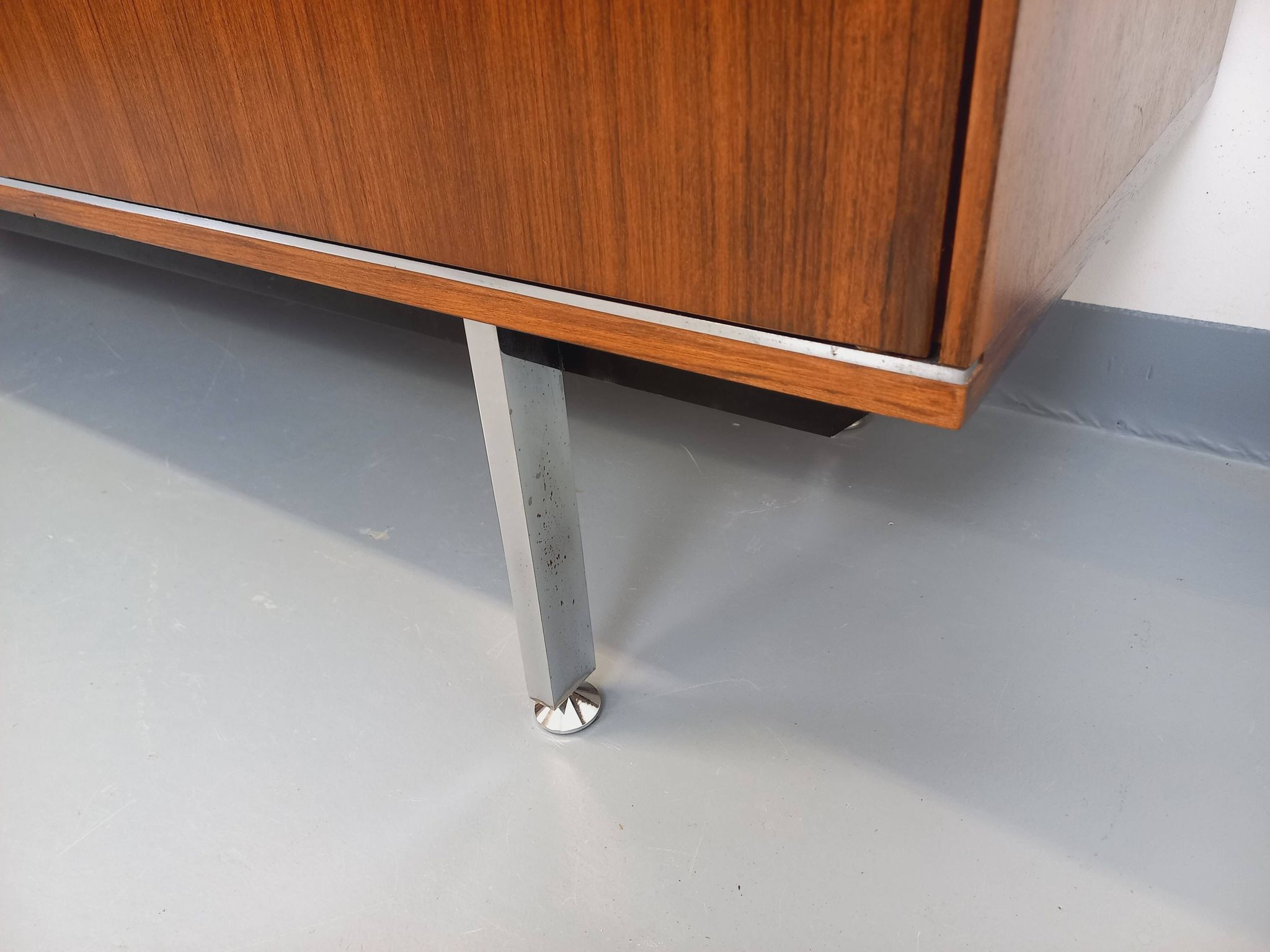 Vintage modernist enfilade in rosewood and chrome metal from the 60s and 70s.
