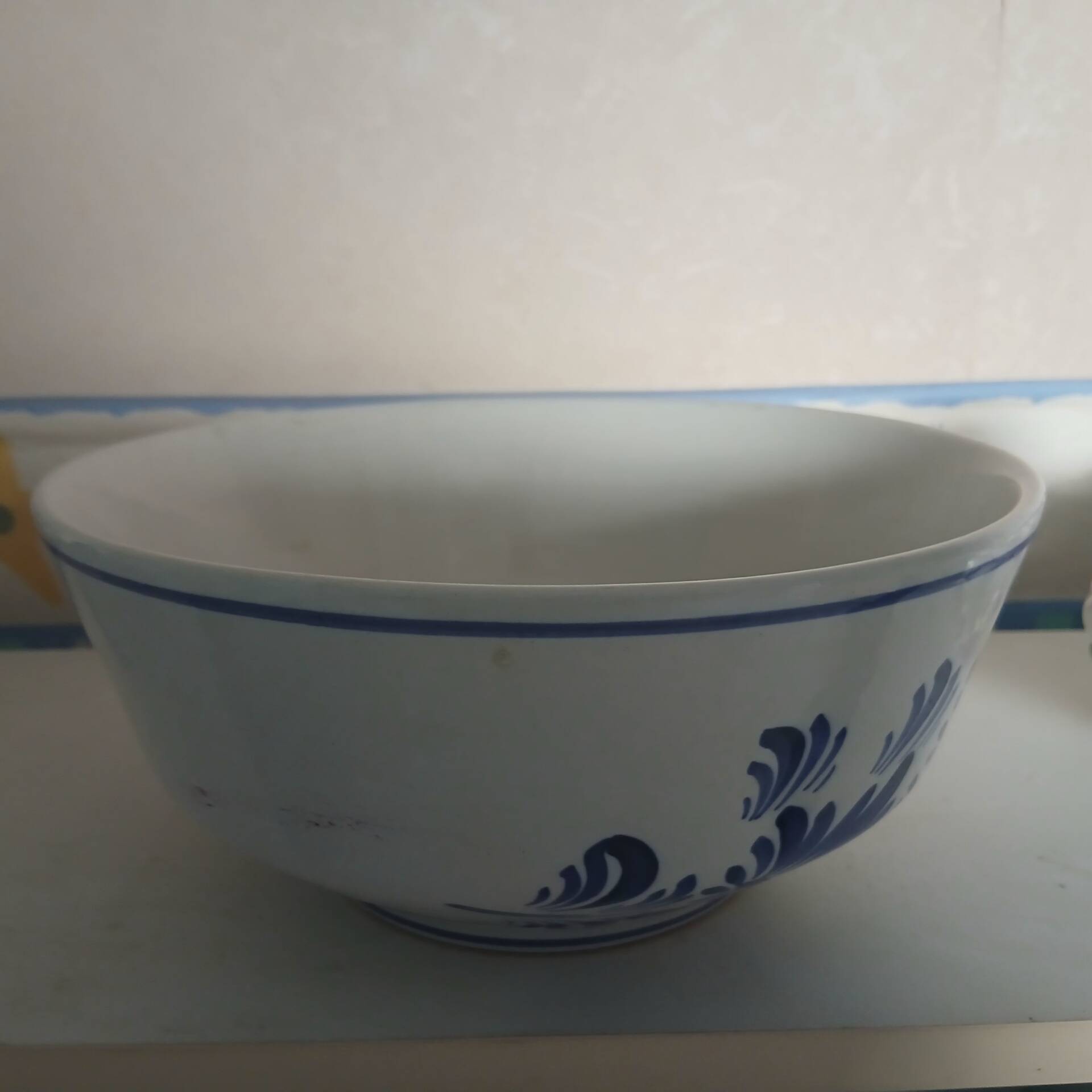 Large white salad bowl with blue flowers