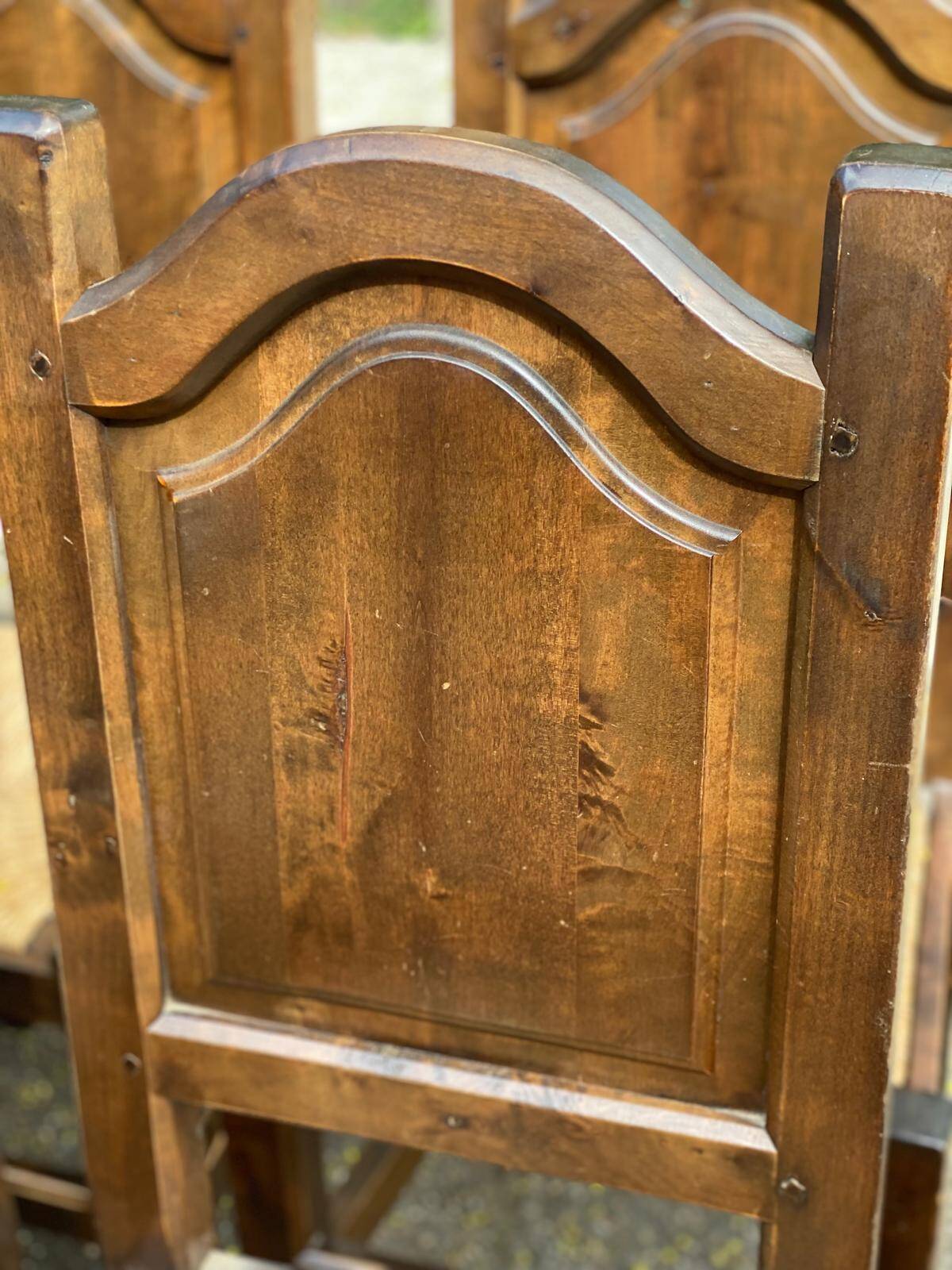 6 dining chairs in a country or farmhouse style, made of dark solid wood and rush-seated.