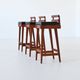 Erik Buck set of three bar stools in teak and leather Dyrlund Denmark 1960