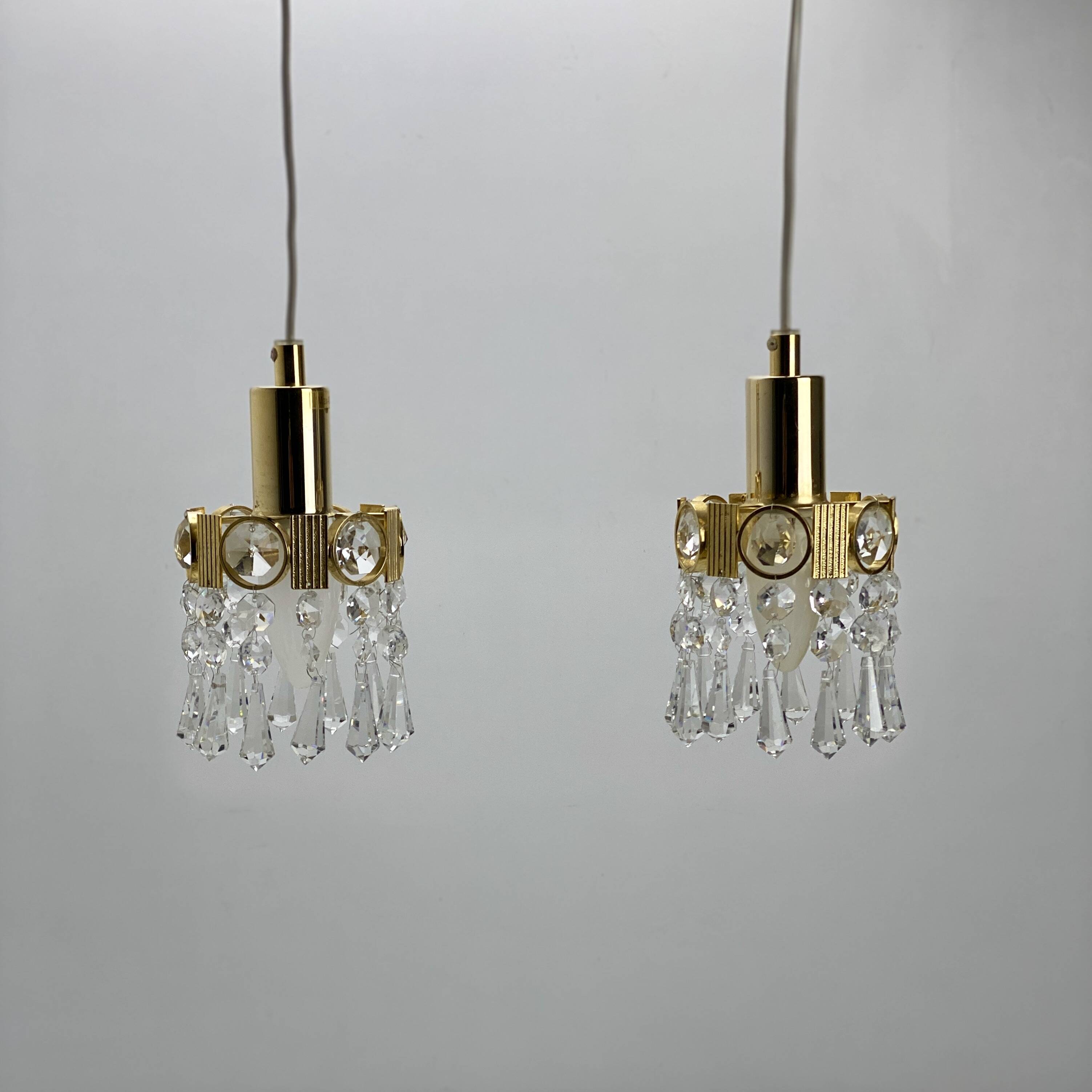 Two gold-plated brass and crystal pendant lights, by Palwa, 1960s design, Hollywood Regency.