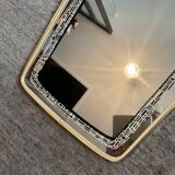 Asymmetrical free-form mirror from the 1970s