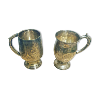 Two old metal cups