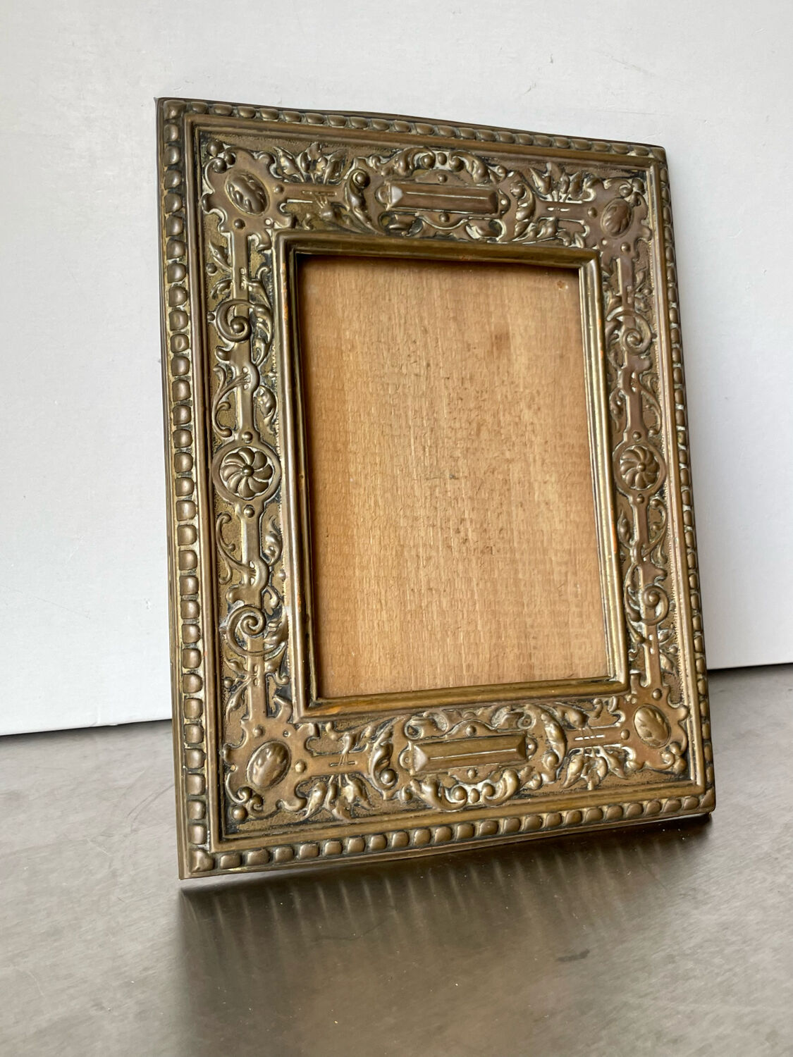 Antique brass metal picture frame in baroque style