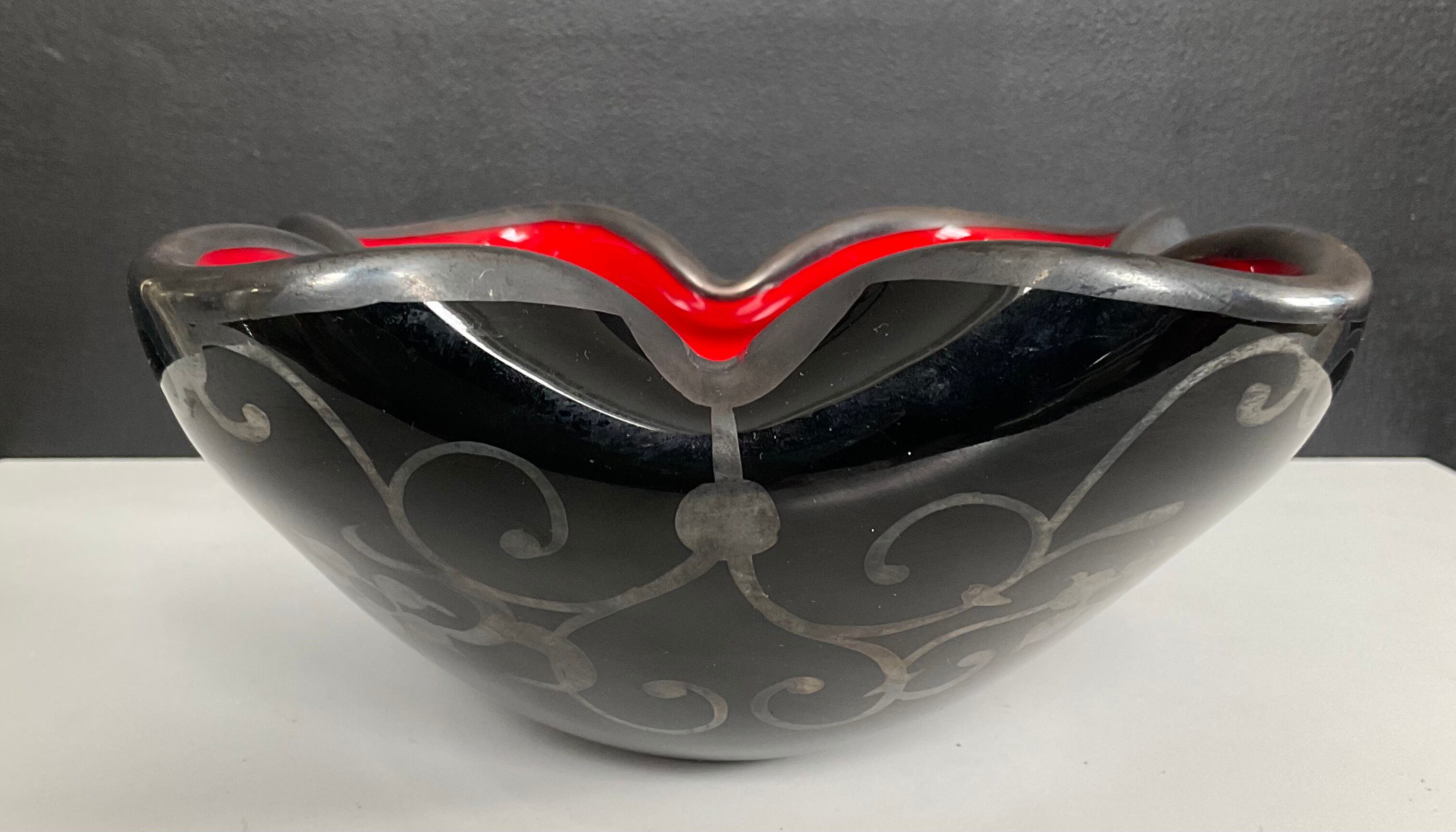 Vintage glass and silver catchall.