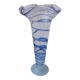 Glass vase on a pedestal with a blue trim.