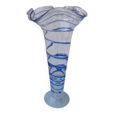 Glass vase on a pedestal with a blue trim.
