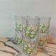 Orangeade service with a jug and six glasses featuring a daisy pattern.