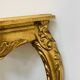Golden console in Louis XV Rococo style made of resin.