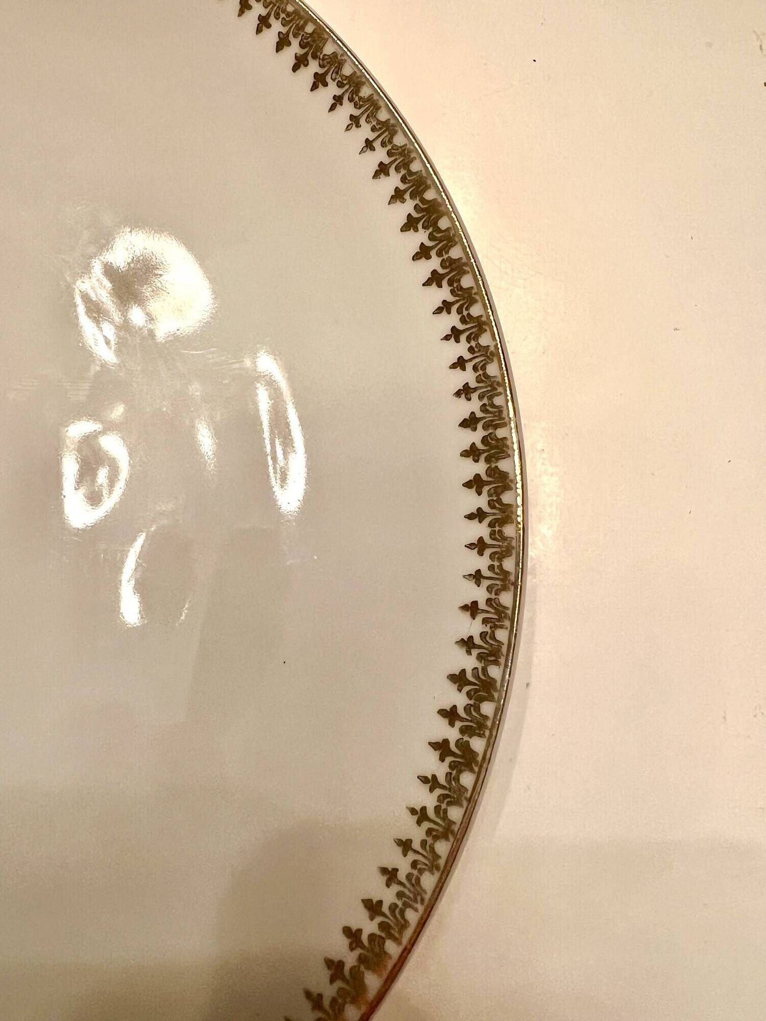 24 plates and a vintage porcelain dish decorated by Lucien Engel.