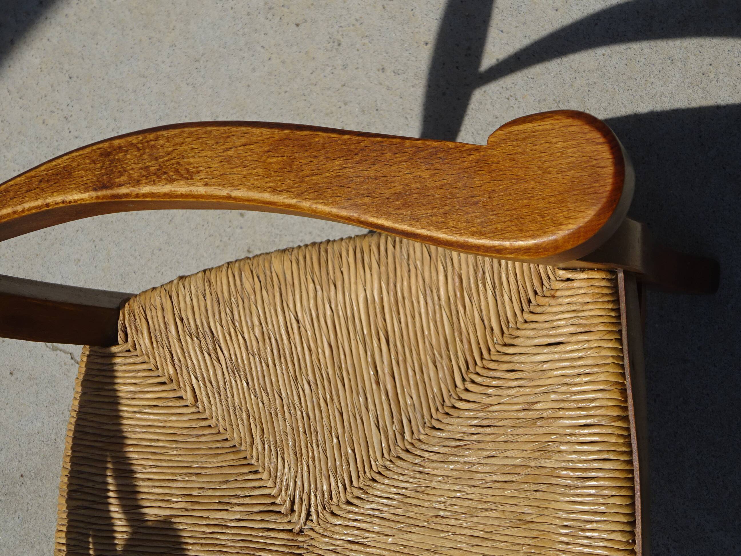 solid wood armchair, straw-covered seat