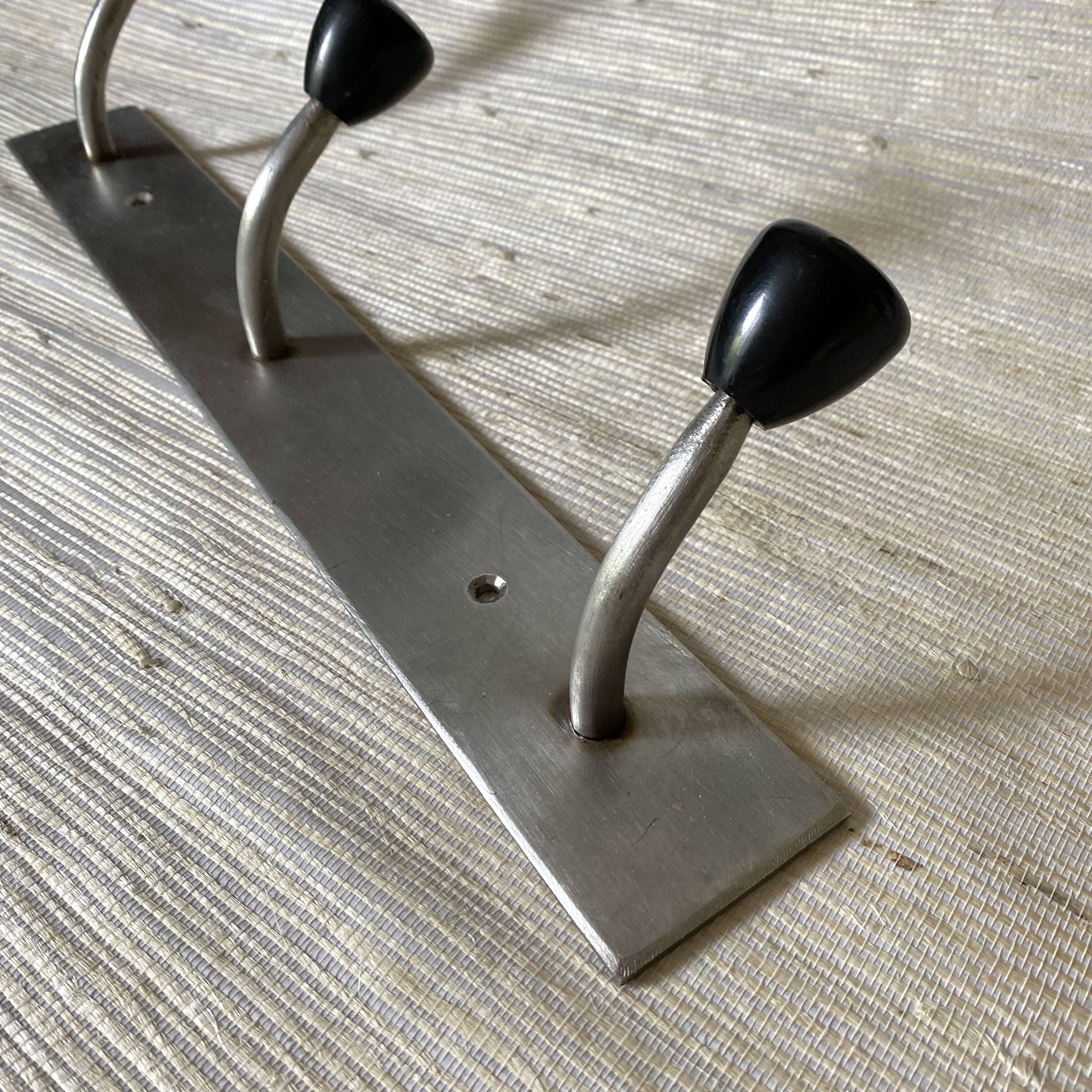 Industrial wall coat rack, 50s