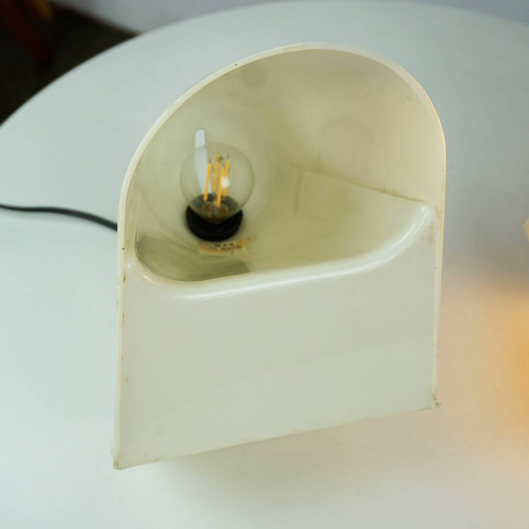 A pair of white plastic table lamps by Cini Boeri for Stilnovo, Italy.