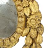 Petit miroir ancien patiné en bois doré du XIXe siècle