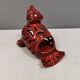 Beautiful seal in ceramic with metallic red glaze.