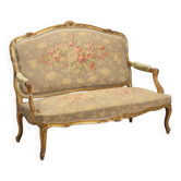 Antique baroque style canapé, gilded wood decorations, 19th century.