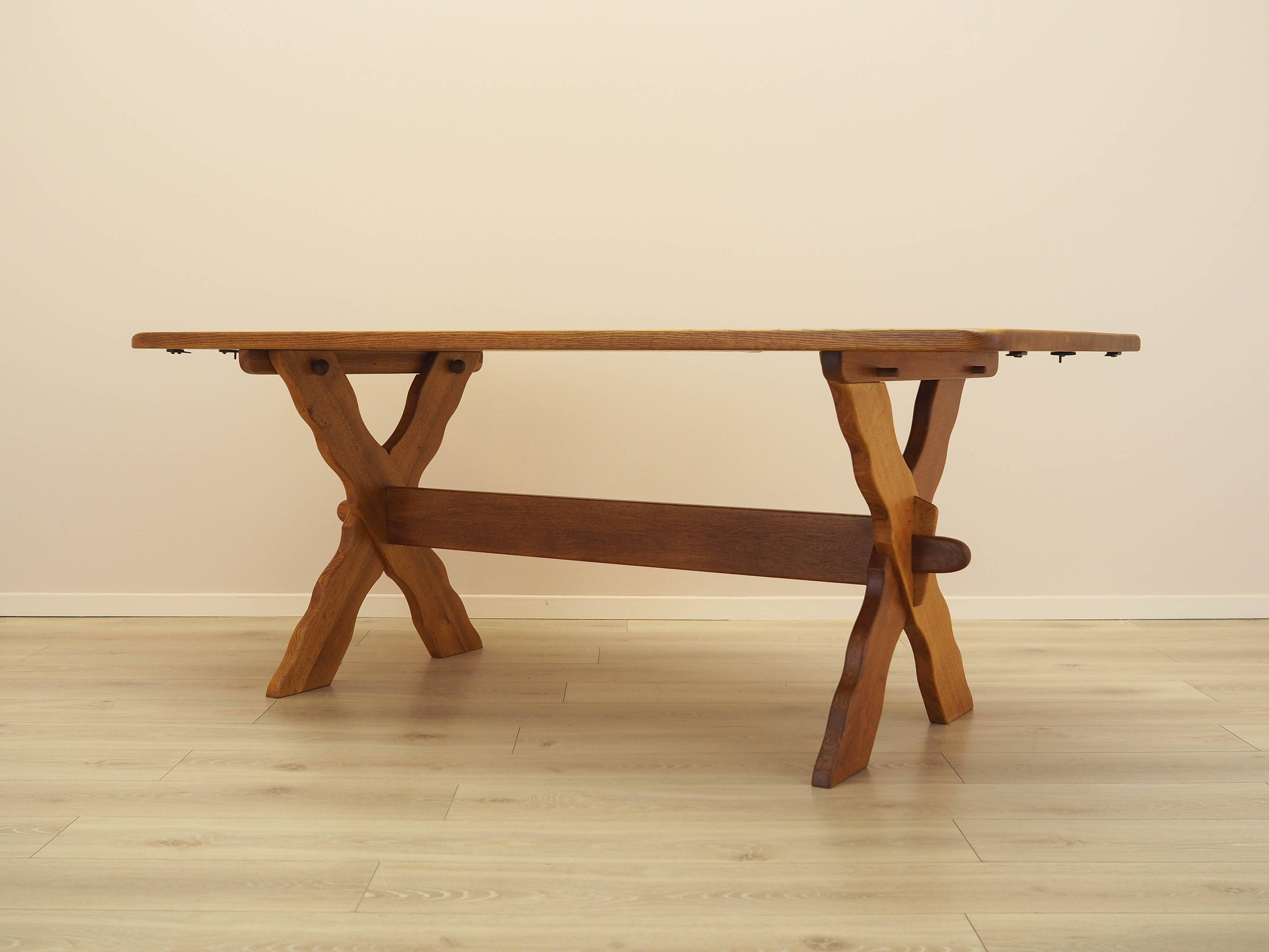 Solid oak dining table by Henning Kjærnulf, Denmark, 1960s