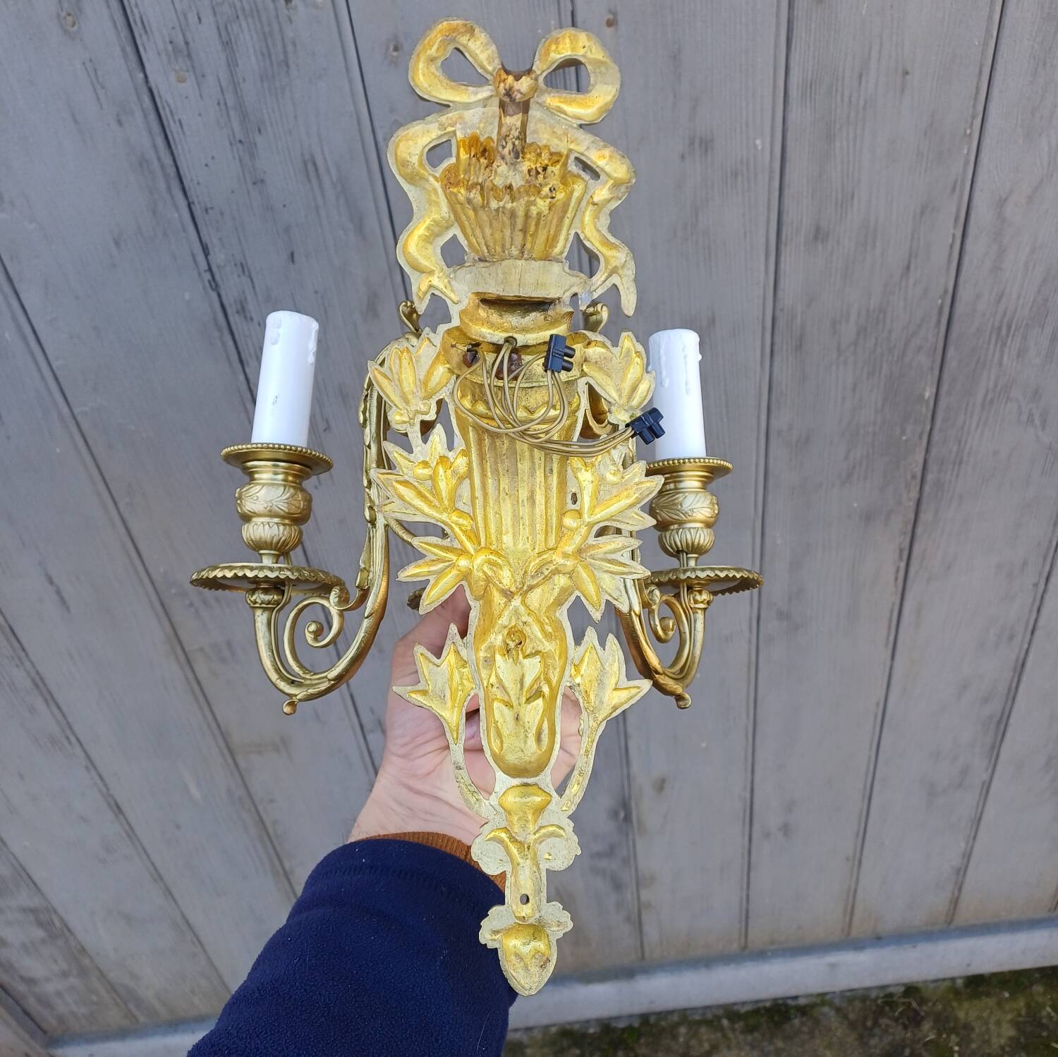 Pair of antique bronze wall sconces from the Napoleonic III era in the Louis XVI style.