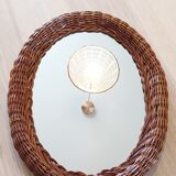 Oval mirror in dark rattan