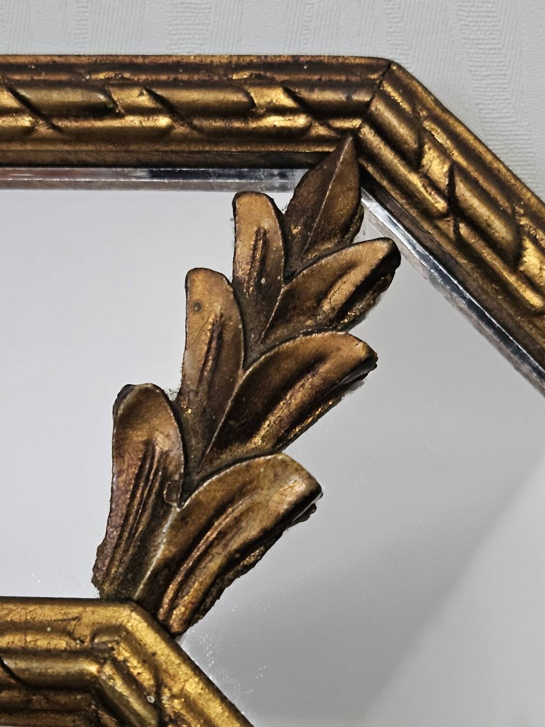 Bevelled mirror with neoclassical parcloses from the 20th century.