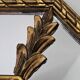 Bevelled mirror with neoclassical parcloses from the 20th century.