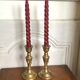 Pair of brass candlesticks with tassels