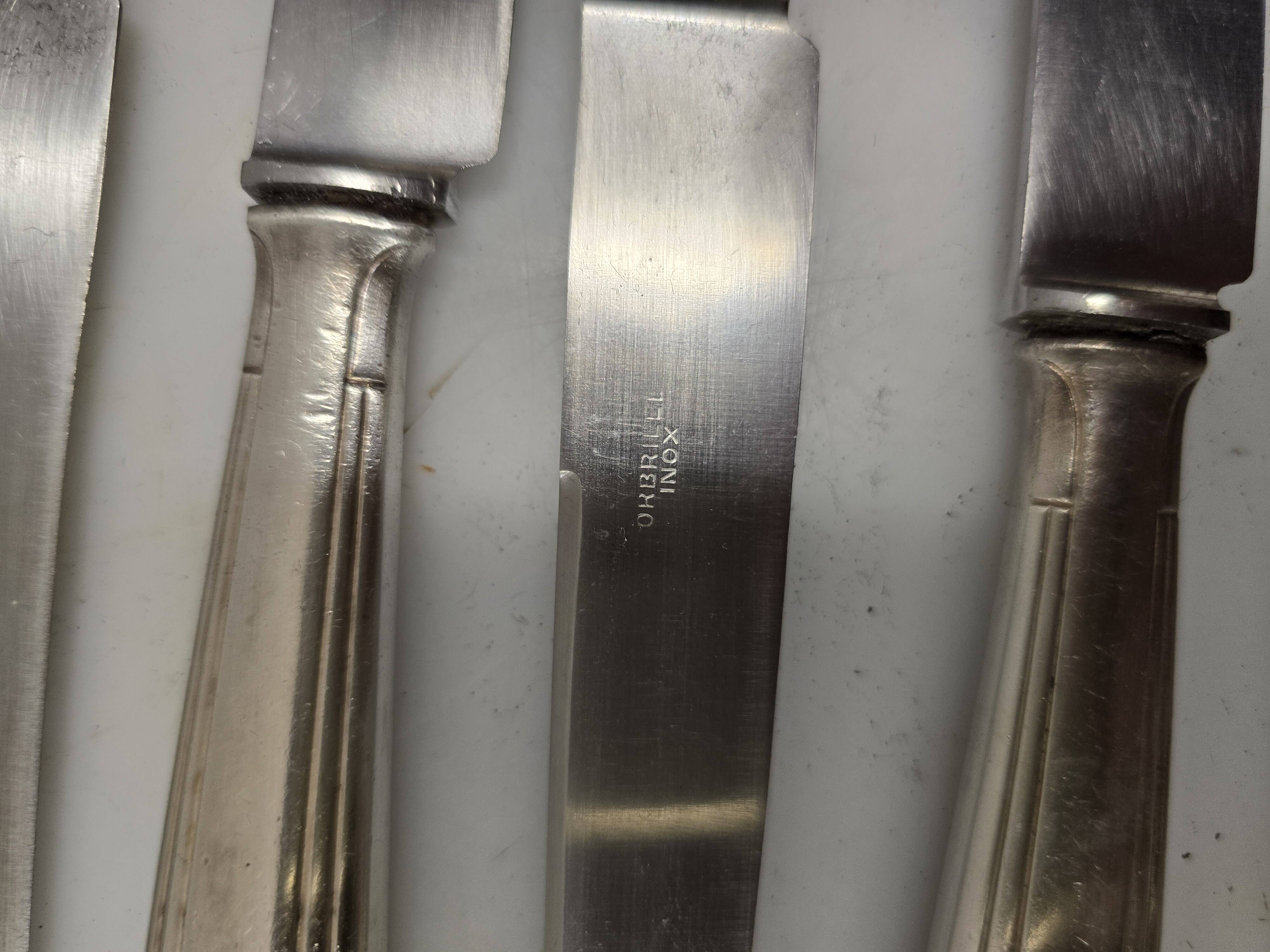 12 silver-plated knives from the mid-20th century