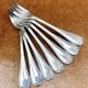 7 Christofle silver-plated oyster forks with Louis crossed ribbons