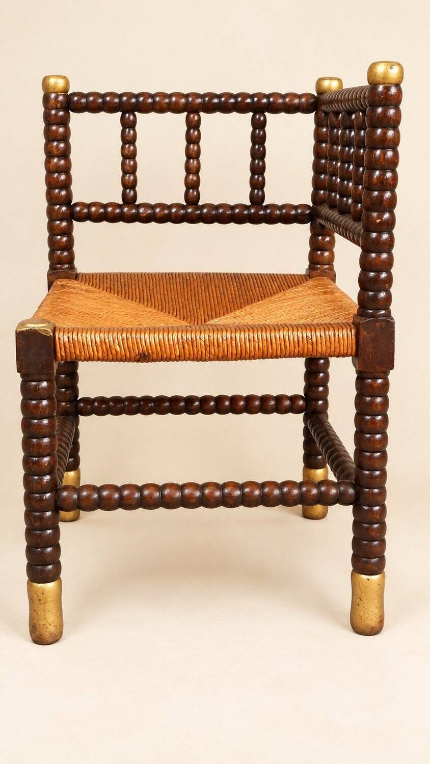Fireplace corner chair in Louis XIII style, turned wood with braided rush, 19th century.