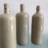 Trio of vintage stoneware bottles