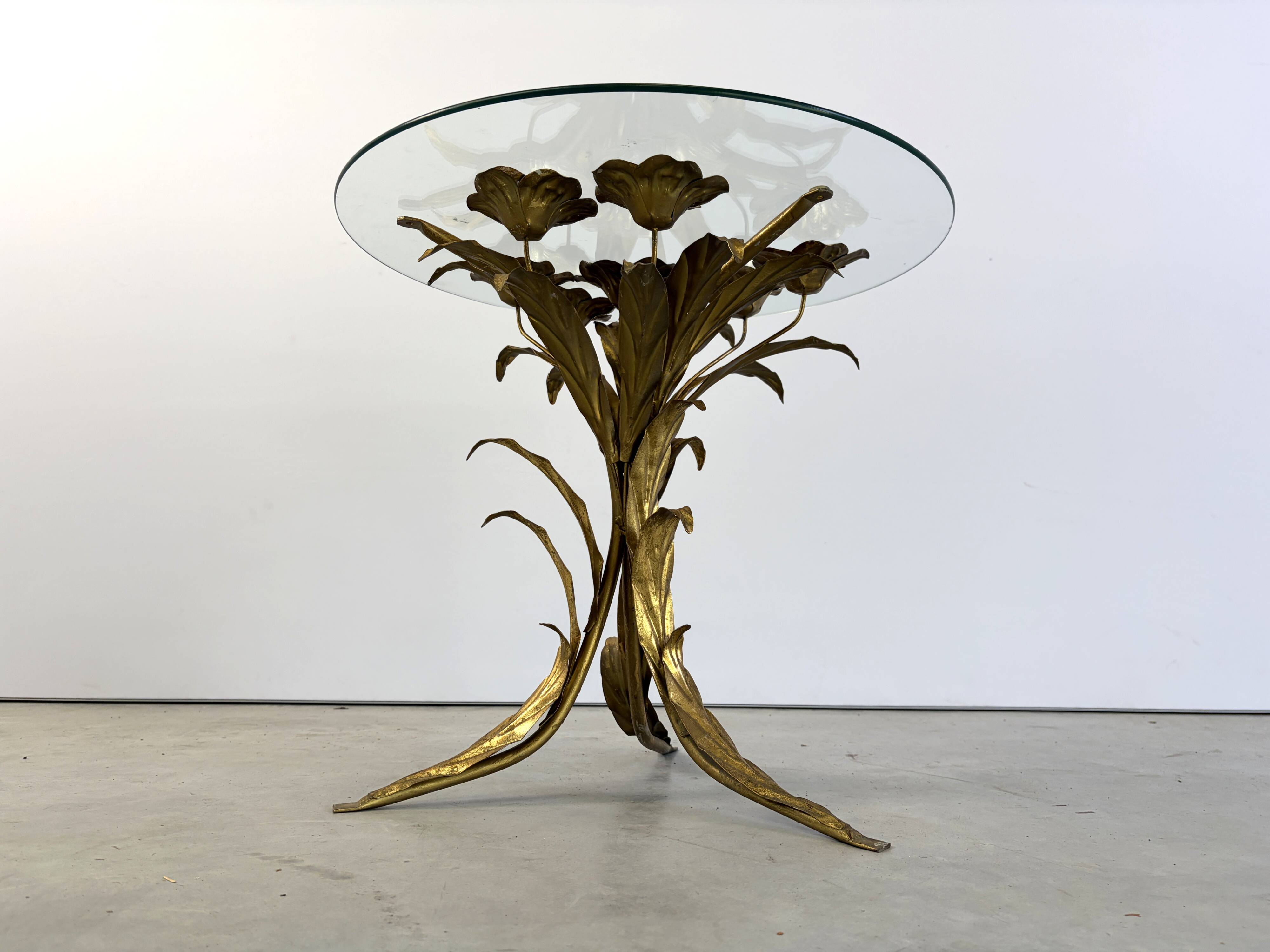 Charming metal flower coffee table or side table with a clear glass top. Made in Italy, attributed to Hans Kögl.
