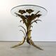 Charming metal flower coffee table or side table with a clear glass top. Made in Italy, attributed to Hans Kögl.