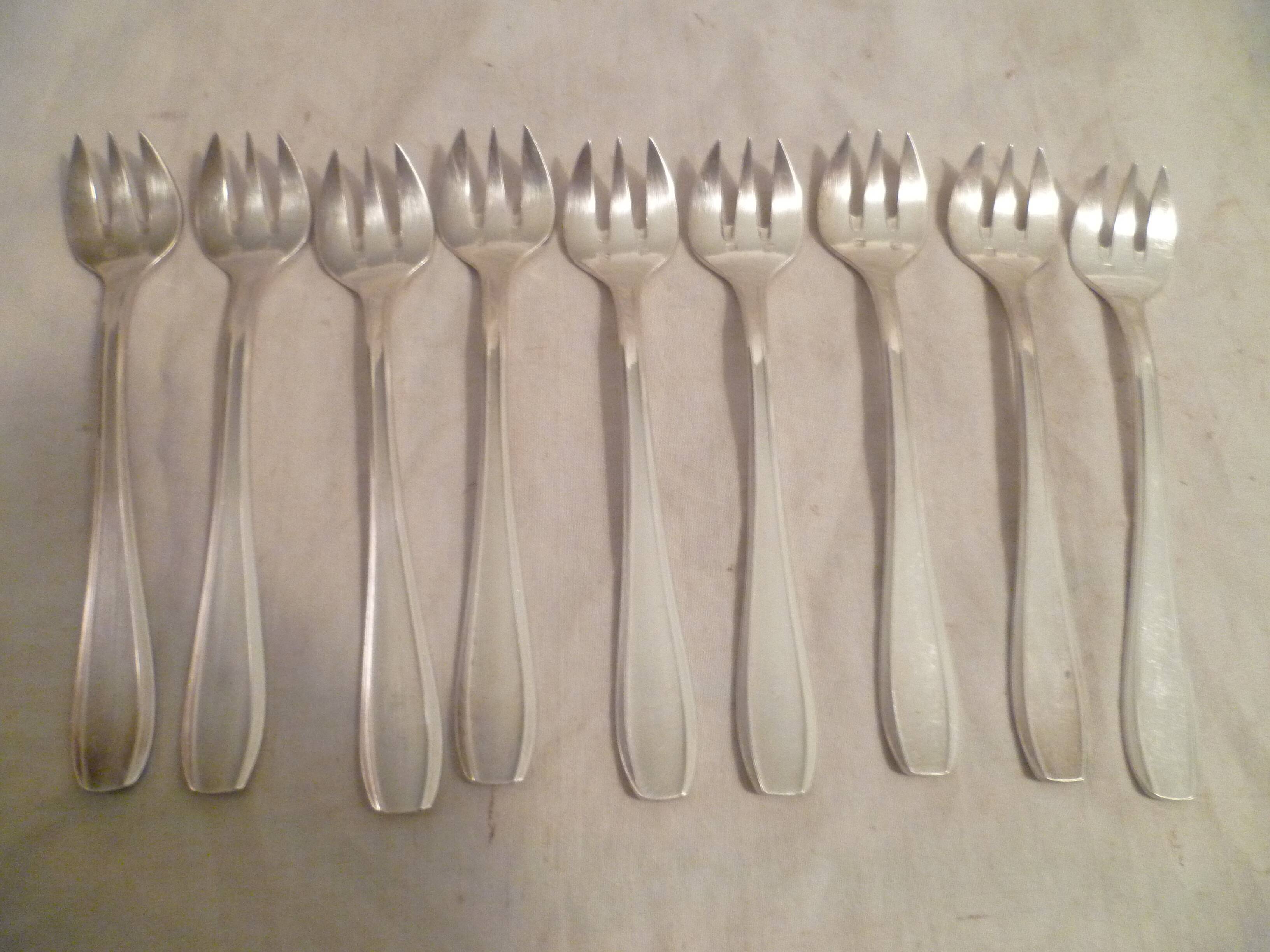 Set of 9 art deco silver oyster forks